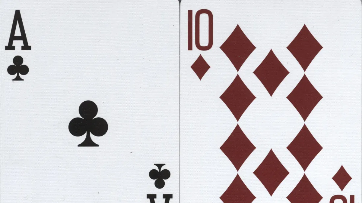 Ace of clubs and ten of diamonds forming a blackjack hand