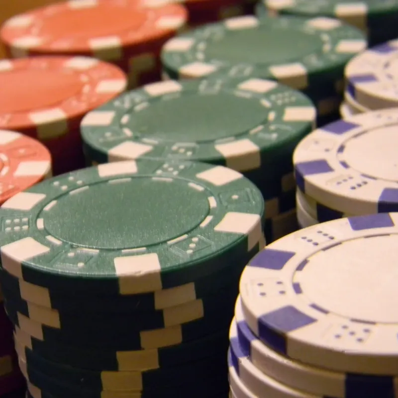 Close-up of stacked red, green and white poker chips